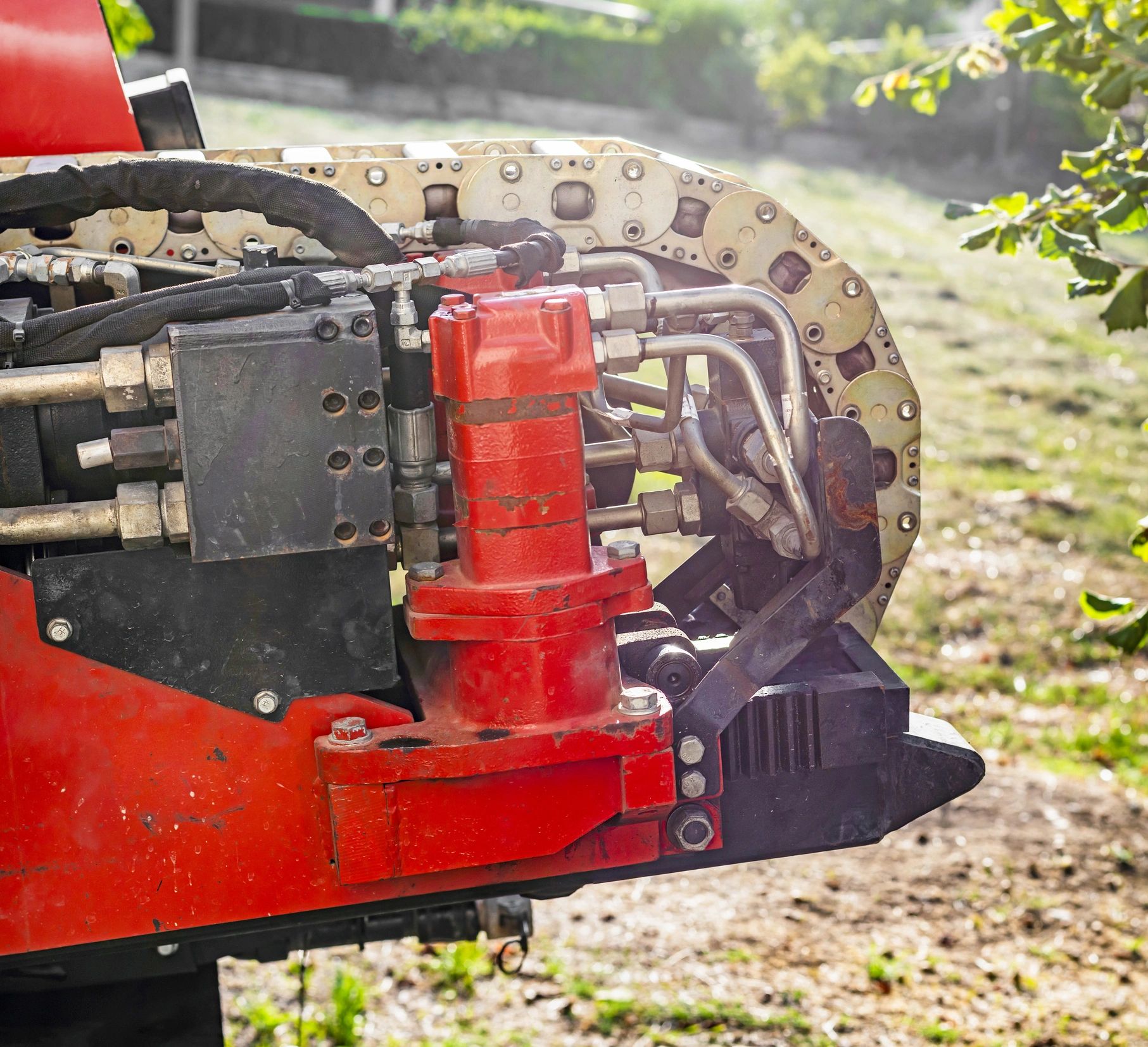 Heavy equipment detail representing professional stump grinding machinery
